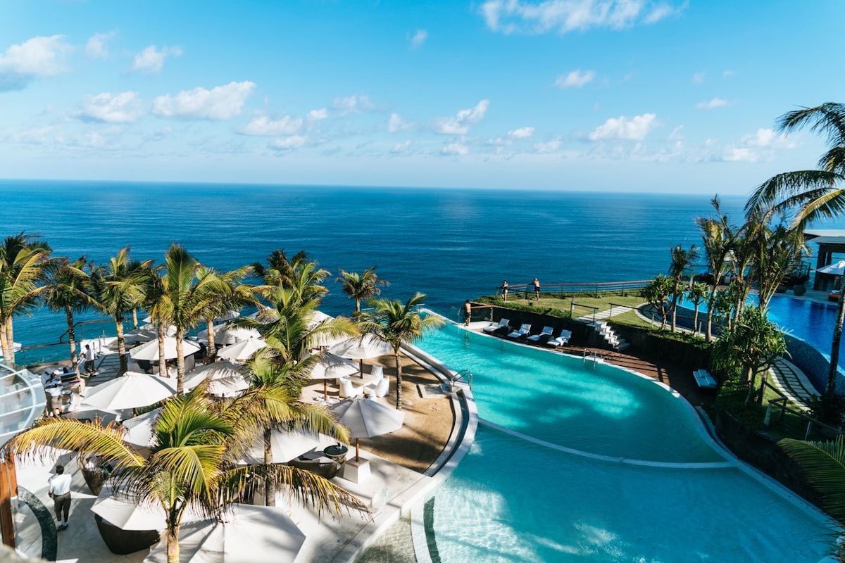 Beachside resort pool with lounge chairs